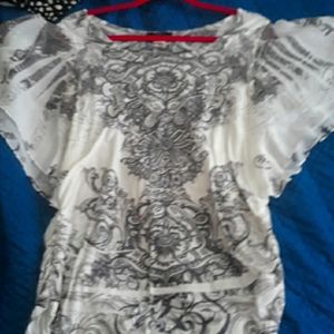 EUC white blouse with black design.